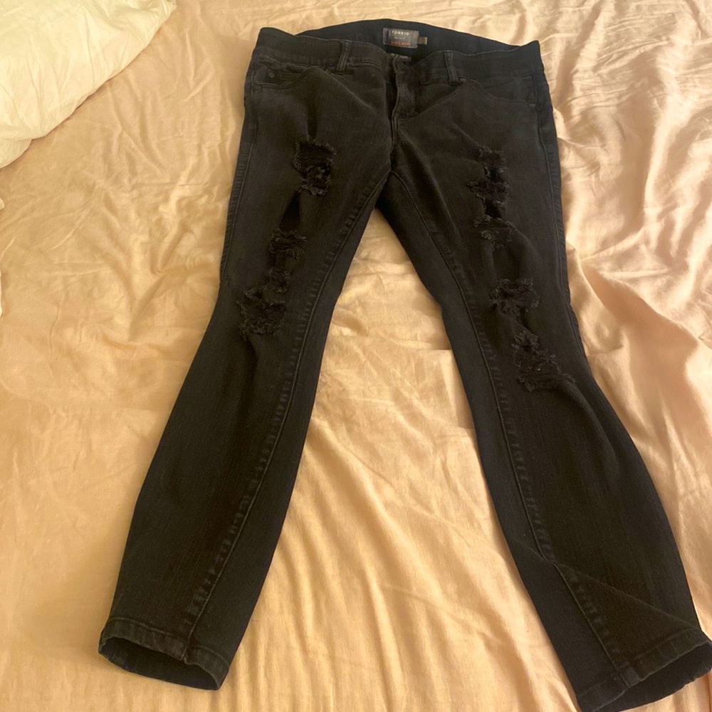 Pair of faded black jeans